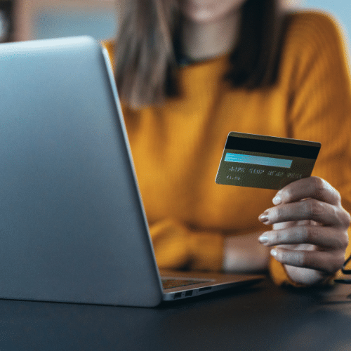 Woman paying with debit card online